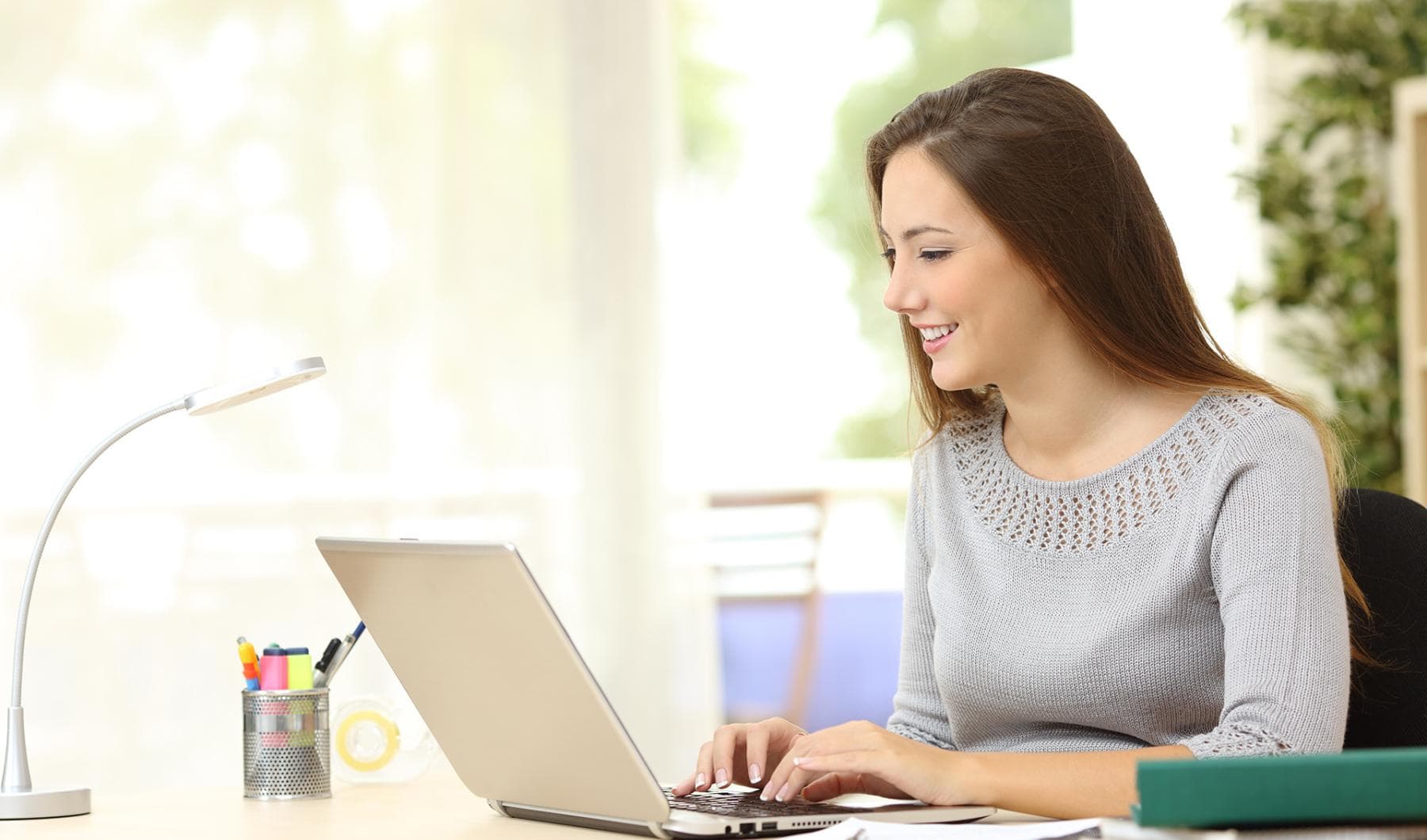 Medical Transcription Editor Certificate Program - Woman entering data on her computer