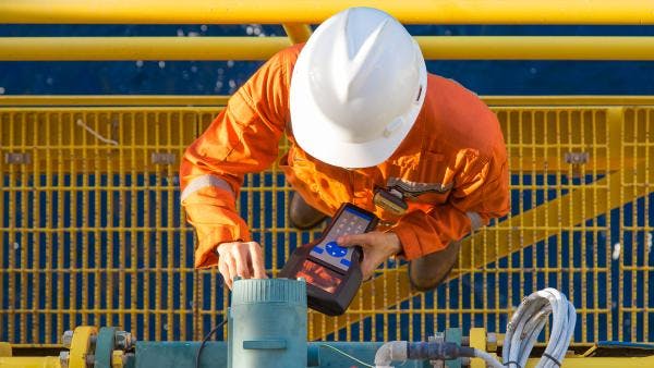 Workers' Compensation Law - Man work's on oil field equipment